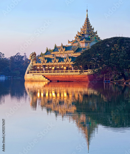 Panoramic view of ancient Karaweik barge at sunset on Kandawgyi Lake in Yangon, Myanmar