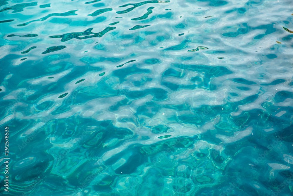 Natural background blue sea with waves, azure clear water beach. Aerial top view