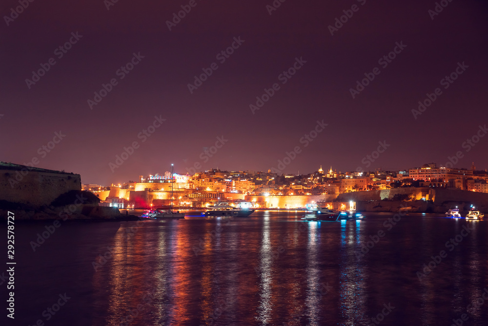 Night view Valletta Malta, stone fortress. Travel concept