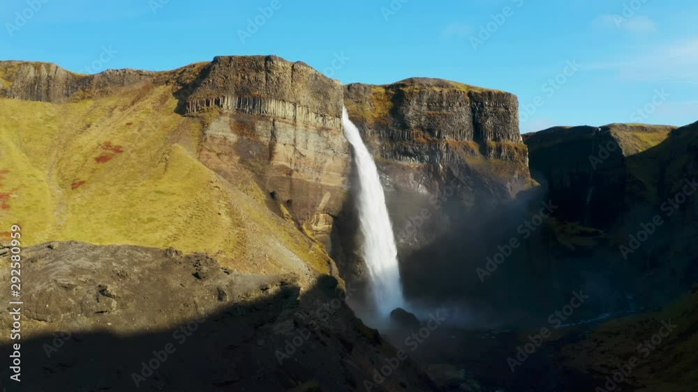 Epic aerial drone view over landscape of the Haifoss waterfall in Iceland.  Nature and ecology concept background.