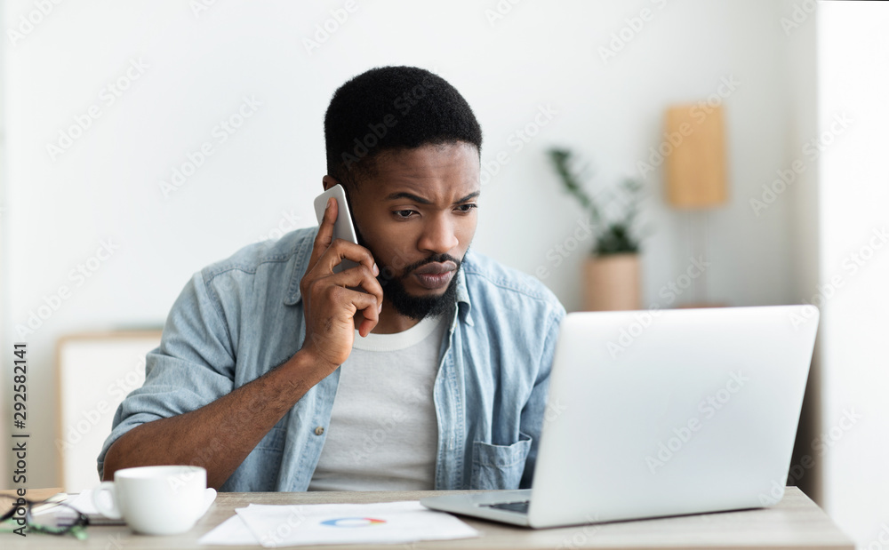 Millennial guy dialing technical support cause his internet is down Millennial guy dialing technical support cause his internet is down