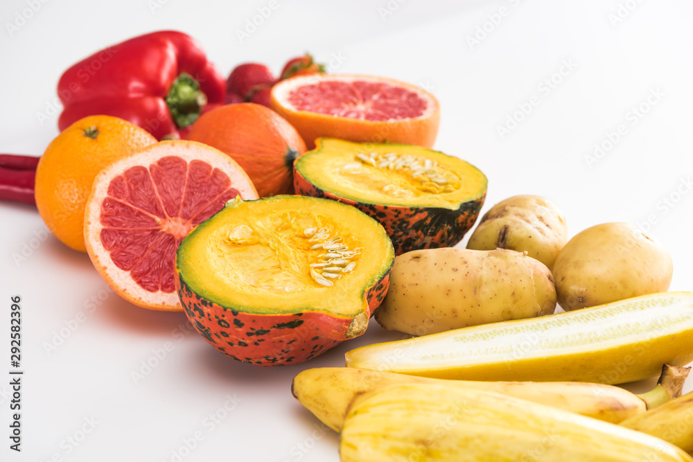 potatoes, zucchini pumpkin, peppers, orange and grapefruit on white background