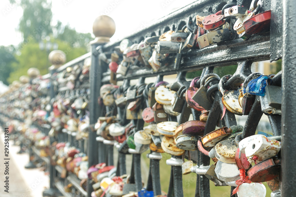 The wedding tradition of the bridge railing hung with locks with the names of lovers.