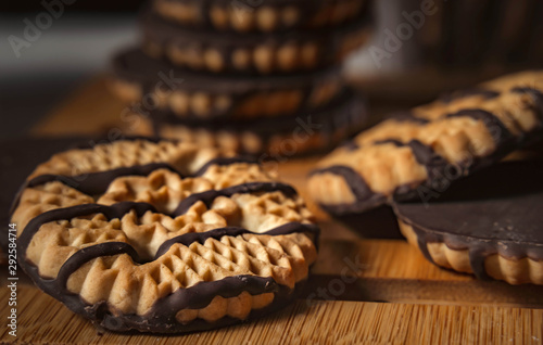 Chocolate cookies on wooden table. Closeup Shortbread cookies chocolate for morning breakfast.