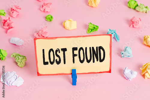 Conceptual hand writing showing Lost Found. Concept meaning Things that are left behind and may retrieve to the owner Colored crumpled papers empty reminder pink floor clothespin