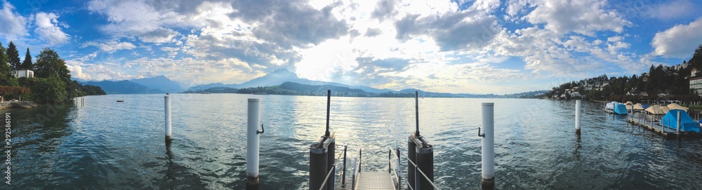 background panoramic view of lake lucerne and boat pier with boats, Lucerne, Switzerland, Europe