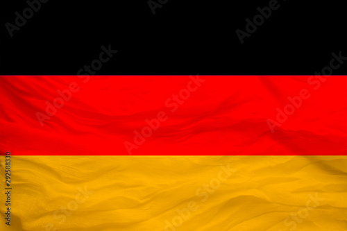 national flag of the country Germany on gentle silk with wind folds  travel concept  immigration  politics  copy space  close-up
