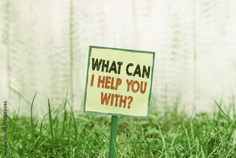 Conceptual hand writing showing What Can I Help You With Question. Concept meaning Offering assistance Experts advice ideas Plain paper attached to stick and placed in the grassy land