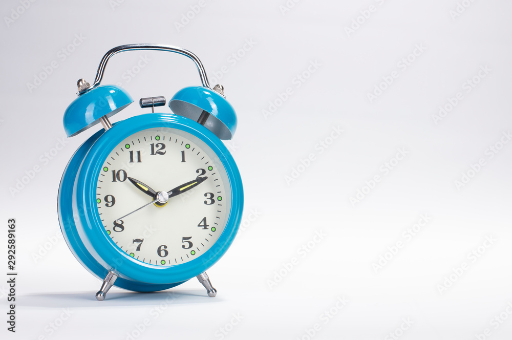 blue alarm clock isolated on white background blue alarm clock isolated on white background