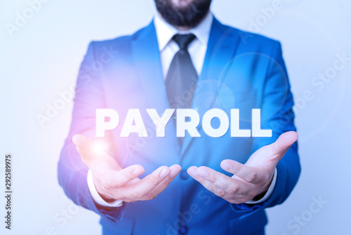 Text sign showing Payroll. Business photo showcasing Amount of wages and salaries paid by a company to its employees Man with opened hands in fron of the table. Mobile phone and notes on the table photo