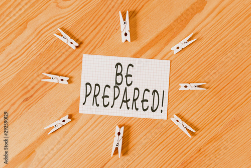 Conceptual hand writing showing Be Prepared. Concept meaning try be always ready to do or deal with something Colored crumpled papers wooden floor background clothespin