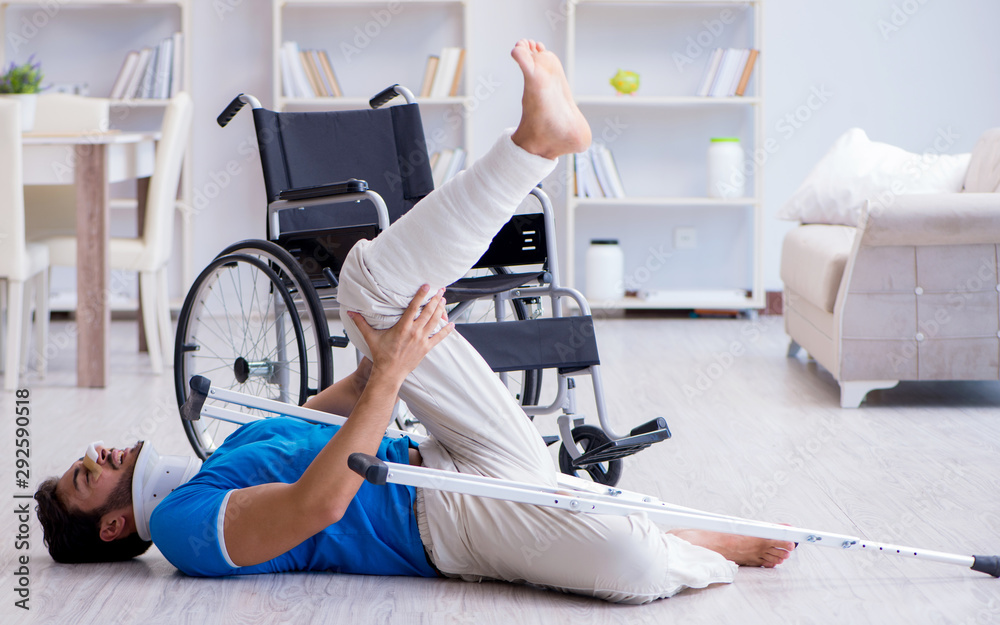 Fototapeta premium Injured young man recovering at home