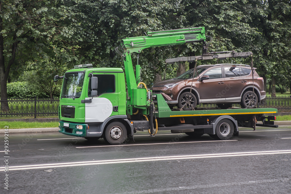 Tow truck transports a car