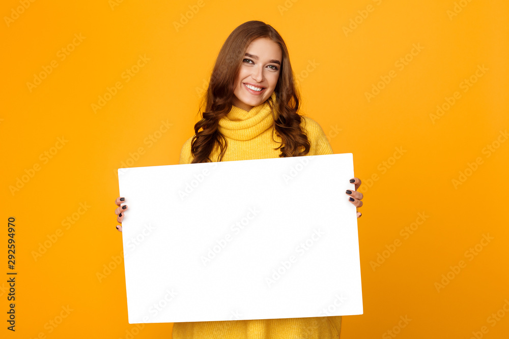 Excited woman showing blank banner with space for text Excited woman showing blank banner with space for text