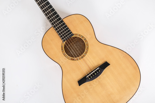 wood texture of lower deck of six strings acoustic guitar on white background. guitar shape