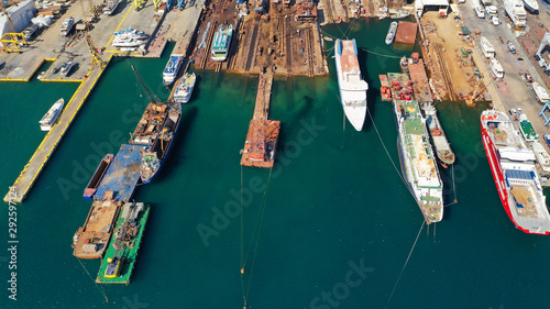 Aerial photo of industrial old shipyard repairing small boats in Mediterranean port © aerial-drone