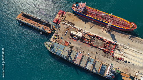 Aerial photo of industrial old shipyard repairing small boats in Mediterranean port