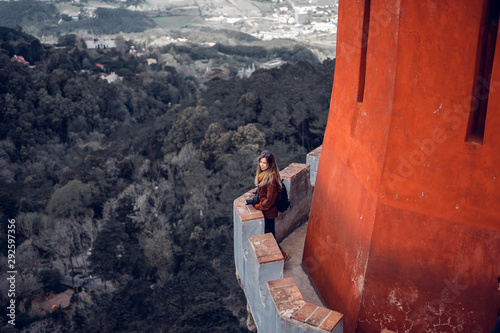 Young woman contemplating the landscape from Palacio da Pena in Sintra, Portugal