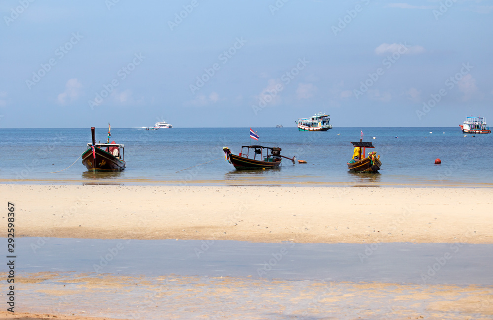 Tropical sea with long tail boat in south thailand 
