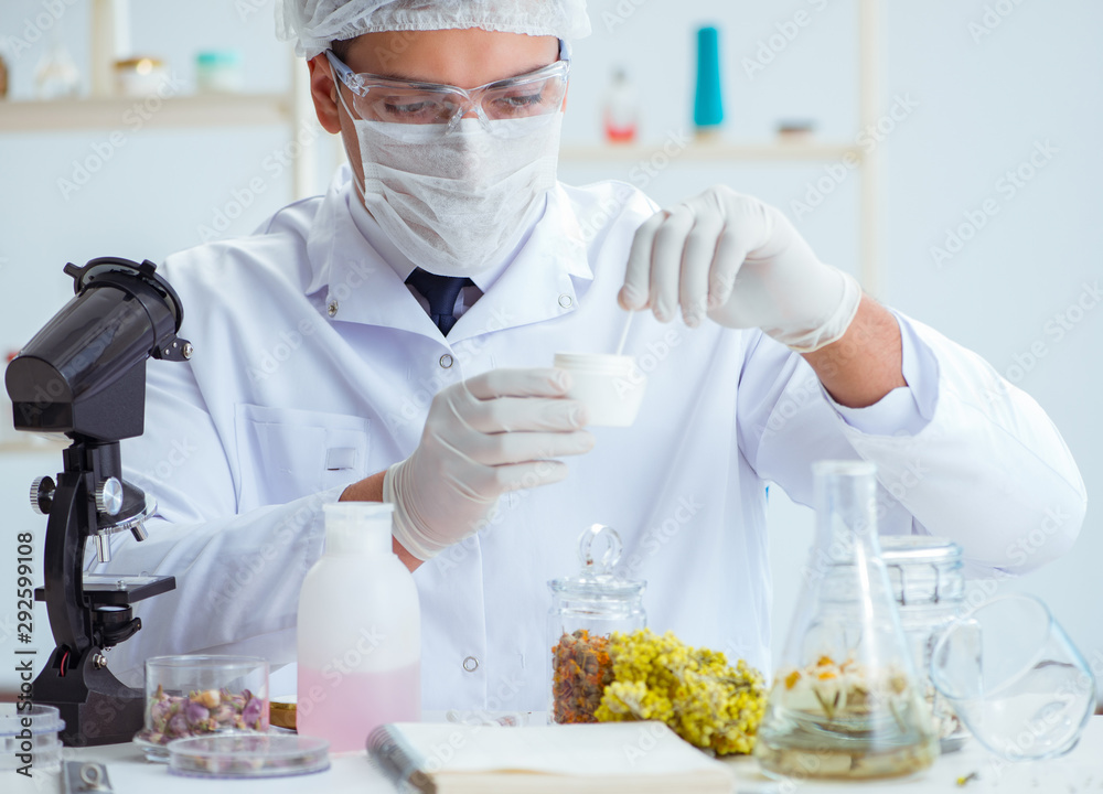 Chemist mixing perfumes in the lab Chemist mixing perfumes in the lab