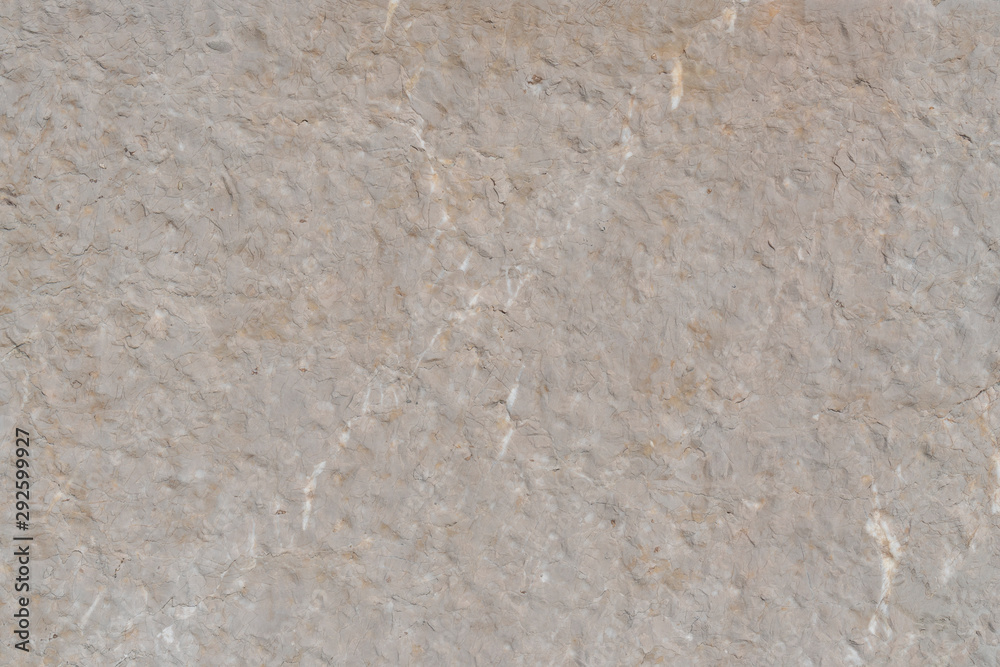 Cracked cement wall with beige structure Cracked cement wall with beige structure