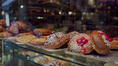 Freshly baked croissants and various gourmet bake for sale in Parisian bakery. Close up. Traditional French Cuisine