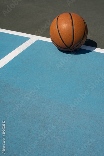 Basketball in bounds on outdoor court