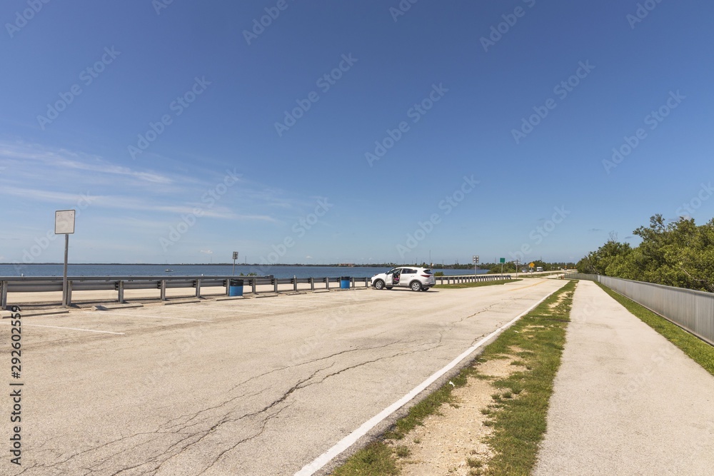 Beautiful landscape view of bridge highway to Key West,  Florida. USA. Blue water of Atlantic ocean merging with blue sky. 