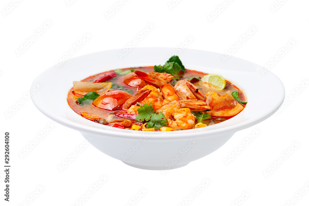 Closeup plate of traditional thai soup - tom yum kung with shrimps and tomatoes isolated at white background.