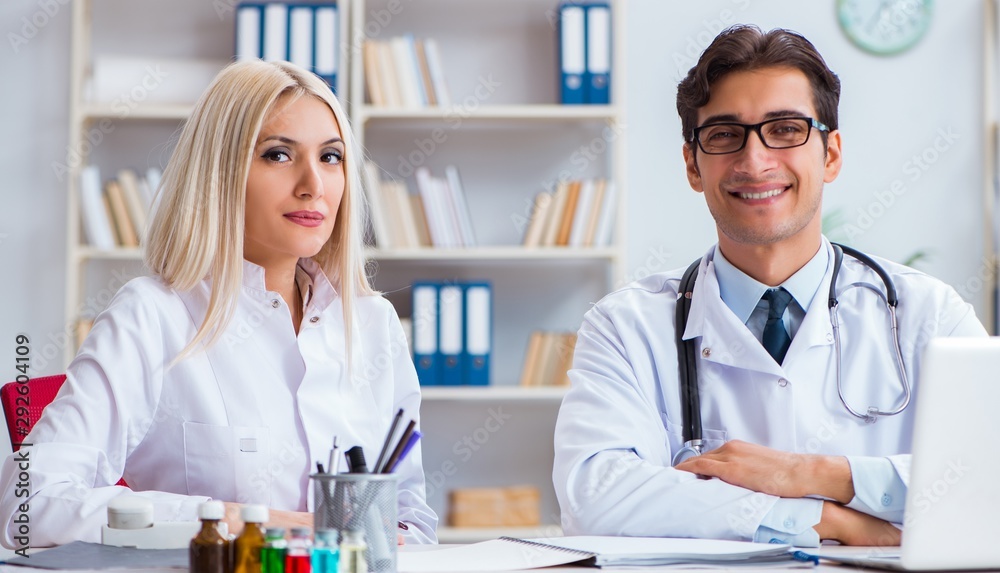 The male and female doctor having discussion in hospital The male and female doctor having discussion in hospital