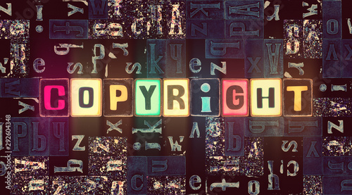 The word Copyright as neon glowing unique typeset symbols, luminous letters copyright
