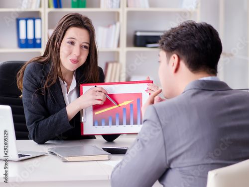 Business meeting between businessman and businesswoman