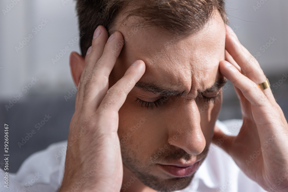 depressed man touching man with closed eyes at home depressed man touching man with closed eyes at home