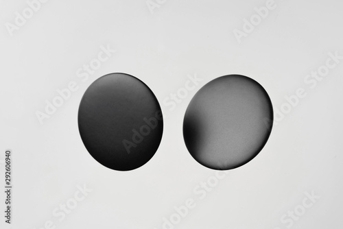 top view of black badge on white background
