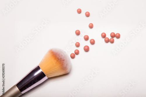 Makeup Brushes isolated on white background with Colorful Pigment Powder