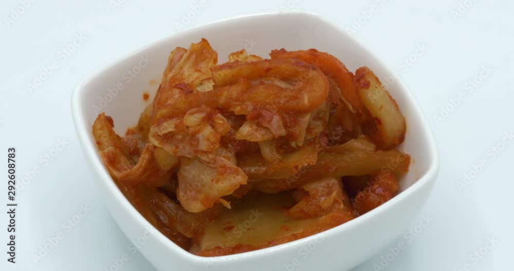 Chili pickled cabbage Gimji rotating on white background. Chili pickled cabbage Gimji rotating on white background.