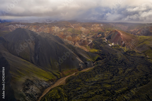 Iceland in september 2019. Great Valley Park Landmannalaugar, surrounded by mountains of rhyolite and unmelted snow. In the valley built large camp. The concept of world tours.