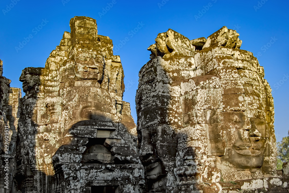 Stone face of Buddha on the ruins of the ancient temple of Bayon. Angkor Thom. Cambodia