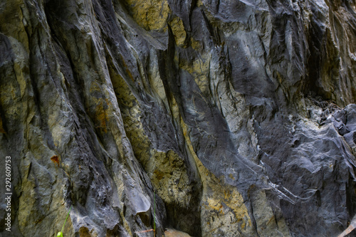 Close-up relief of big rocks. Natural igneous rock background texture