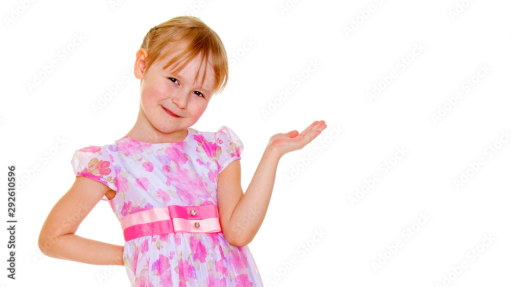 Little girl is showing a finger.The concept of advertising goods Little girl is showing a finger.The concept of advertising goods