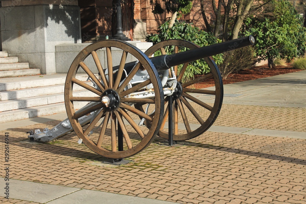 Vintage restored cannon on display in small town square