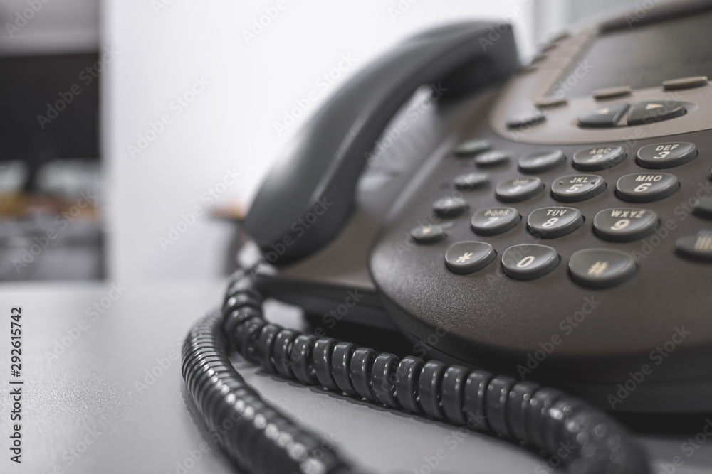 Closeup keypad telephone on desk office Closeup keypad telephone on desk office