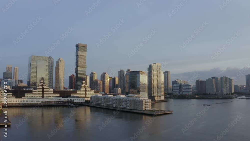 Aerial: Waterfront Buildings in New York at Sunrise - New York City, New York Aerial: Waterfront Buildings in New York at Sunrise - New York City, New York