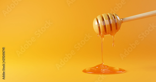 Honey dripping on yellow background. 3d rendering