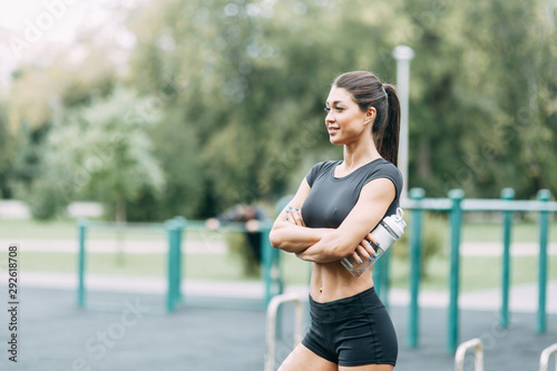  Is worth and smiles on nature. Beautiful athletic girl on the Playground.