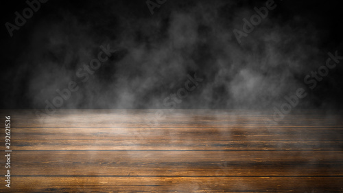 Top wooden table with fog. Wall with smoke on isolated black background. Design element.
