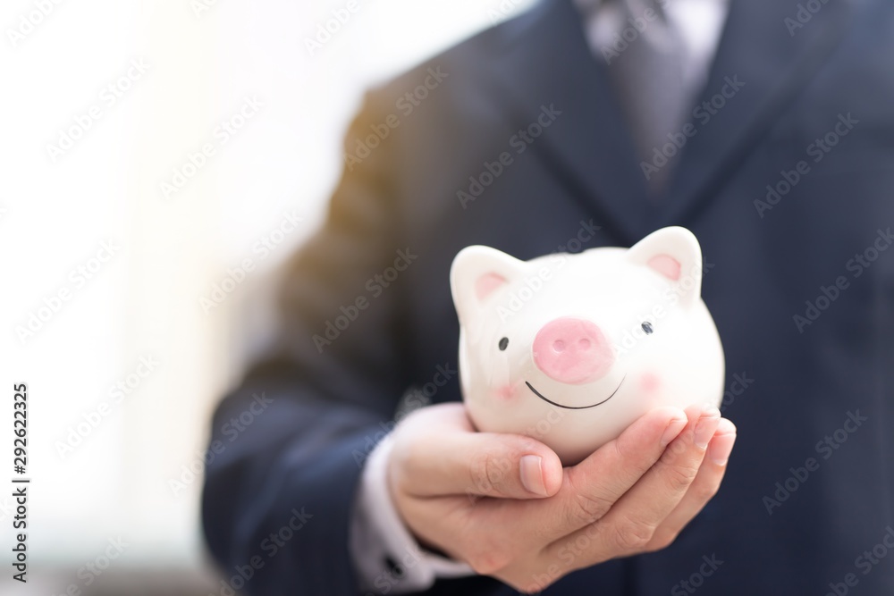 Man  with piggy bank closeup