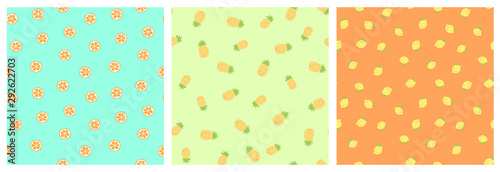 Kid's seamless pattern. Smiling pineapple and lemon. Orange slice. Exotic fruit fashion print. Design elements for baby textile or clothes. Hand drawn doodle. Cute tropical wallpaper for children