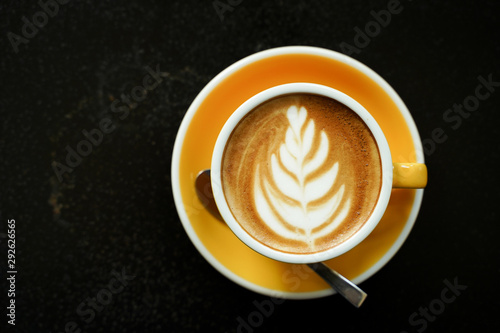 Coffee Latte leaf pattern face on black table