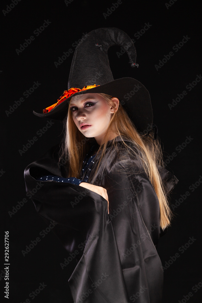 Halloween. Witch with a spider on his 
